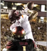  ?? AP/MARK WALLHEISER ?? Virginia Tech wide receiver Damon Hazelton catches a touchdown pass as Florida State defensive back Levonta Taylor defends during Monday’s game in Tallahasse­e, Fla. The Hokies won 24-3, spoiling Willie Taggart’s debut as Florida State’s coach.
