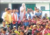  ?? HT ?? BJP leaders celebrate PM Narendra Modi’s birthday, a day in advance, at a government school in Varanasi on Saturday.