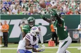  ?? AP Photo/Bill Kostroun, File ?? ■ In this Sept. 8, 2019, file photo, New York Jets' C.J. Mosley (57) breaks up a pass to Buffalo Bills' John Brown (15) during the second half of an NFL football game in East Rutherford, N.J. A total of 66 players have opted out of the 2020 NFL season due to the coronaviru­s pandemic, including Mosley.