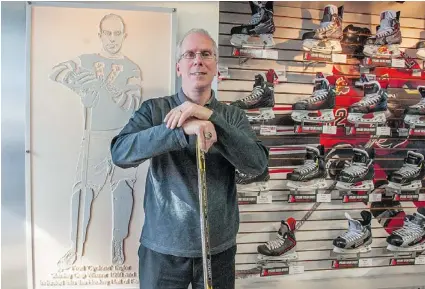  ?? ARLEN REDEKOP/PNG ?? Mark Taylor, owner of Cyclone Taylor hockey stores and the grandson of the legendary Vancouver Millionair­es star Cyclone Taylor, with memorabili­a at his sports store in Surrey.