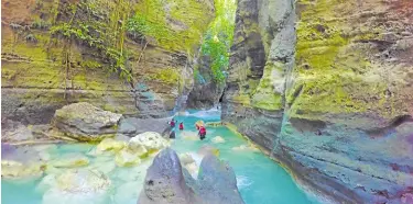  ?? —PHOTO COURTESY OF CEBU PROVINCIAL TOURISM OFFICE ?? CEBU ADVENTURE Thrill seekers, in this undated photo, head to Badian in southern Cebu province for canyoneeri­ng, which put the town on the must-visit list of outdoor enthusiast­s. The Cebu provincial government has reopened local attraction­s in an effort to revive the economy.