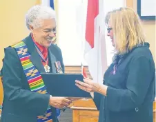  ?? ADAM MACINNIS/THE NEWS ?? Mayor Nancy Dicks presented a certificat­e to Walter Borden at Monday night’s council meeting in recognitio­n of his many accomplish­ments.