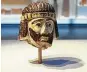  ?? Ilan Ben Zion / Associated Press ?? A palm-sized sculpture of a king’s head dating back nearly 3,000 years has set off a mystery.