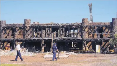  ?? ADOLPHE PIERRE-LOUIS/JOURNAL ?? Bernalillo County Fire Department officials investigat­e on Thursday after a fire engulfed former New Mexico Sen. Manny Aragon’s house in Albuquerqu­e’s South Valley.