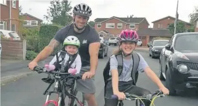  ??  ?? Ava Smallman completes her challenge with dad Mark and sister Katie