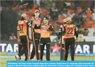  ?? — AFP ?? HYDERABAD: File photo shows Sunrisers Hyderabad cricketer Rashid Khan (C) celebrates with teammates the wicket of Mumbai Indians Ben Cutting during the 2018 Indian Premier League (IPL) Twenty20 cricket match between Sunrisers Hyderabad and Mumbai...