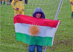  ?? SUPPLIED ?? Dayan, a young supporter for team Kurdistan braved the conditions to show his support.