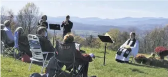  ?? COURTESY PHOTO ?? On a gorgeous sunny and warm autumn Sunday, Nov. 8, Tom and Cole Johnson welcomed sixty Trinity parishione­rs to their beautiful mountain top on Red Oak mountain for the Trinity's Harvest Festival Service.