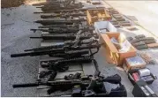  ?? CHANNEL 2 ACTION NEWS ?? The weapons and ammo found at George Frank Roach’s house are legally owned and used for hog hunting, says a friend. Roach was arrested following a standoff with a SWAT team serving a warrant.