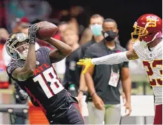  ?? BRYNN ANDERSON/ASSOCIATED PRESS ?? Atlanta star wide receiver Calvin Ridley, left, here attempting a catch during an Oct. 3 game against Washington, is taking time away from football to deal with mental-health issues.