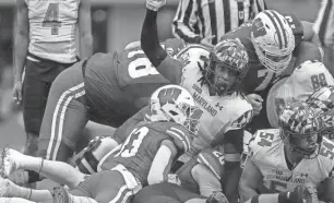  ?? TORK MASON/USA TODAY NETWORK-WISCONSIN ?? Maryland linebacker Jaishawn Barham (1) signals for a fourth down after tackling Wisconsin running back Isaac Guerendo (20) on Nov. 5, 2022.