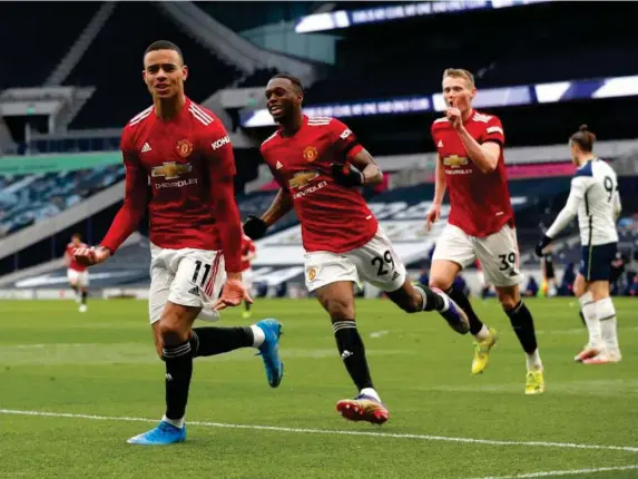  ??  ?? Mason Greenwood celebrates after scoring United's third goal (Getty)