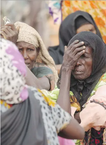  ?? OLI SCARFF/GETTY IMAGES/FILES ?? Somali refugees in Dadaab are being forced home, despite questions of safety.