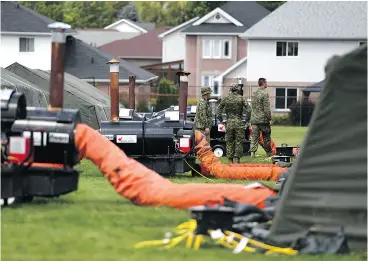  ?? JUSTIN TANG / THE CANADIAN PRESS ?? A tent city wasn’t needed and the number of temporary residents in Cornwall’s conference centre is dwindling as the flow of illegal migrants to Canada slows.