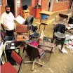  ?? | THEO JEPTHA ?? NAVINDRA Rampath, principal of Windsor Secondary School with soaked books and school furniture. African News Agency (ANA)