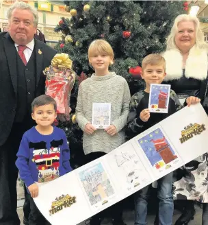  ??  ?? Winners of Accrington Market Hall’s Christmas card competitio­n receive their prizes. From left, mayor Coun Tim O’Kane, runner-up Freddie Holland, aged three, winner Parish Hawke, aged 10, runner-up Jack Read, aged seven and mayoress Melanie Storey