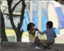  ?? Eric Gay/Associated Press ?? Children play at a camp of asylum seekers in Matamoros, Mexico.