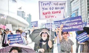  ??  ?? Anti-North Korean activists attend a protest against the inter-Korean summit in Seoul.