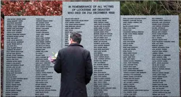  ?? SCOTT HEPPELL / AP, FILE ?? A man looks at the main memorial stone in memory of the victims of the bombing of Pan Am flight 103, in the garden of remembranc­e near Lockerbie, Scotland on Dec. 21, 2018.