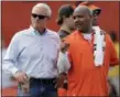  ?? TONY DEJAK — THE ASSOCIATED PRESS ?? Browns owner Jimmy Haslam, left, and coach Hue Jackson talk during practice at team’s training camp facility in Berea on July 27.