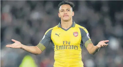  ?? Picture / AP ?? Alexis Sanchez gestures to the Arsenal fans, as if they can do something about the Gunners’ plight.