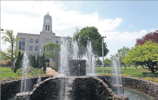  ?? [STEVE STEPHENS/DISPATCH PHOTOS] ?? A fountain featuring a statue of a boy with a leaky boot, on the grounds of the Erie County Courthouse in Sandusky