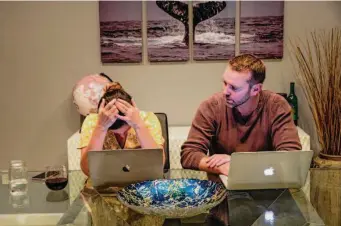  ?? ?? Geri Landman works with husband Zach Landman on their nonprofit to find therapies for Lucy’s genetic disorder, Moonshots for Unicorns, at the family’s home in Danville.