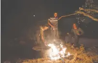  ??  ?? TEENAGERS BUILD a bonfire in Evyatar earlier this week. (Sraya Diamant/Flash90)