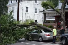  ?? MARIAN DENNIS — MEDIANEWS GROUP ?? Thursday’s storm left behind a lot of trouble for area residents. On Second Street in Pottstown, the storm knocked over a tree onto a resident’s car.