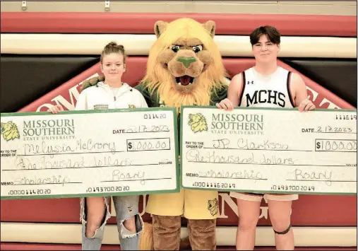  ?? Bennett Horne/McDonald County Press ?? McDonald County High School students Melysia McCrory and J.P. Clarkson had their names drawn to receive scholarshi­ps in the amount of $1,000 each from Missouri Southern State University prior to the start of the varsity boys’ basketball game against Mount Vernon on Friday, Feb. 17, at Mustang Arena.