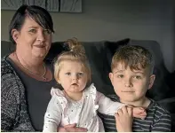  ?? MURRAY WILSON/STUFF ?? Kim Wheelhouse is concerned her 8-year-old son Luke, right, has not had an annual check-up in two years. Her 7-month-old daughter Poppy got called for a check-up when she had no teeth.