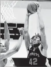  ?? Steve Galluzzo For The Times ?? KA’VEON BATISTE of Westcheste­r tries to dunk over Robert McRae of Fairfax in the second quarter.