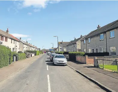  ?? Pictures: Kris Miller. ?? Top: Lee McGregor, of Ballater Place in Dundee, feels right at home among his neighbours as the street, above, has been identified as the least British in the UK.