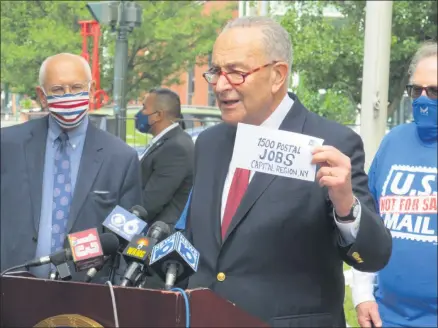  ?? MICHAEL GWIZDALA — MEDIANEWS GROUP ?? U.S. Senate Minority Leader Chuck Schumer speaks out against actions being taken to cripple the United States Postal Service, at the post office on Broadway in Troy, Monday morning.