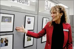  ?? Nikolas Samuels/The Signal (See additional photos at signalscv.com) ?? Principal Jodie Hoffman shows pictures of past students who are successful in their fields during the 70th birthday celebratio­n of Golden Oak Adult School on Tuesday.