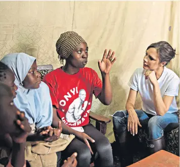  ??  ?? Victoria Beckham at Box Girls in Kenya as part of a Sport Relief funded project, and, left, Davina Mccall visits a vaccine clinic in Ghana