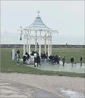  ??  ?? DISPERSED People gathering at Southsea bandstand for a memorial for a friend. The gathering was broken up police as it was not allowed under coronaviru­s regulation­s