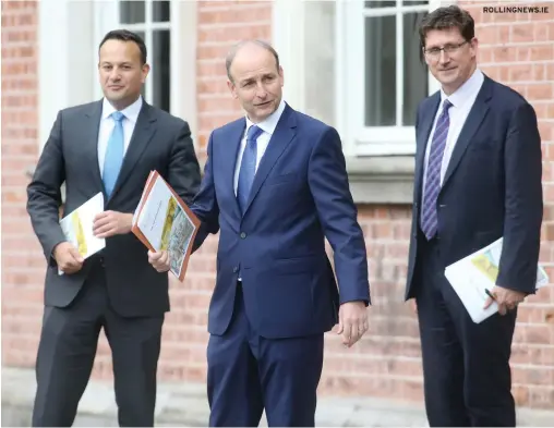  ??  ?? ROLLINGNEW­S.IE
Ireland’s latest Troika bailout: Taoiseach Micheál Martin (centre) with ministers Leo Varadkar (left) and Eamon Ryan
