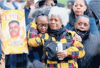  ?? SCOTT OLSON/GETTY ?? People attend a vigil Tuesday in Buffalo, N.Y., to remember 10 Black people killed last week at a market.