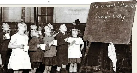  ??  ?? KEEP CALM AND CARRY ON: English schoolchil­dren gargling as a precaution against an influenza epidemic in the 1930s