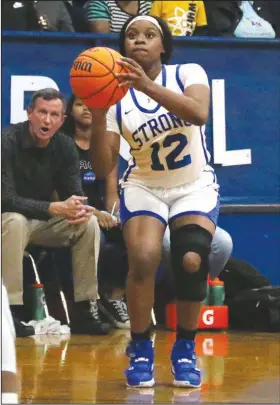  ?? Siandhara Bonnet/News-Times ?? Taking aim: Strong’s Dynasty Davis takes aim as she gets ready to take a shot during the Lady Bulldogs’ 8-1A contest against Emerson during the regular season. Strong will take on Caddo Hills in the opening round of the 4-1A Regional Tournament today.