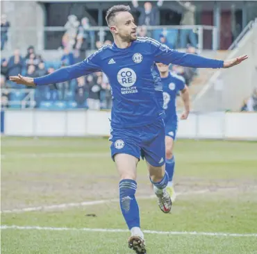  ?? ?? MATCH-WINNER: Matty Warburton’s two goals earned The Shaymen a crucial win against Woking at The Shay on Saturday. Photo: Marcus Branston.