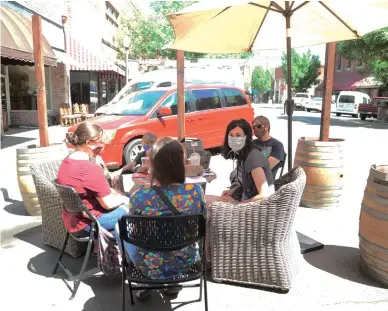  ?? David Wilson/appeal-democrat ?? Customers sit on D Street on Friday where seating is available for patrons of Brick Coffee House Cafe in Marysville.