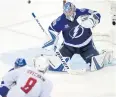  ?? AP ?? The Lightning’s Andrei Vasilevski­y blocks a shot from the Capitals’ Alex Ovechkin.