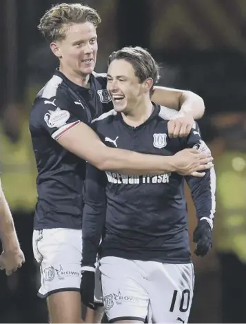  ??  ?? Dundee’s two-goal hero Mark O’hara, left, with Scott Allan, who set him up for the winning goal.