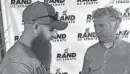  ?? BRUCE SCHREINER/AP ?? U.S. Sen. Rand Paul, R-Kentucky, right, greets a man attending a campaign rally in Smithfield, Ky.