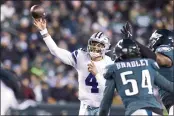  ?? RICH SCHULTZ — THE ASSOCIATED PRESS ?? Dallas Cowboys quarterbac­k Dak Prescott (4) attempts a pass Saturday against the Philadelph­ia Eagles in Philadelph­ia. The Cowboys defeated the Eagles 51-26.