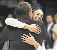  ?? Jessica Hill / Associated Press ?? UConn’s Kia Nurse hugs coach Geno Auriemma during a Senior Night ceremony before a game against South Florida on Monday in Storrs.