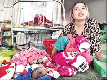  ?? SUPPLIED ?? Uong Chantha, 40, speaks after giving birth to her sixth child in Kampong Cham in 2017. An official on Tuesday acknowledg­ed a funding shortfall for the Kingdom’s 2019 census, which will collect demographi­c data on births and other statistics.