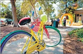  ?? Smith Collection ?? A BIKE sculpture outside Google headquarte­rs in Mountain View. The company is offering more paid leave to employees taking care of children or family.